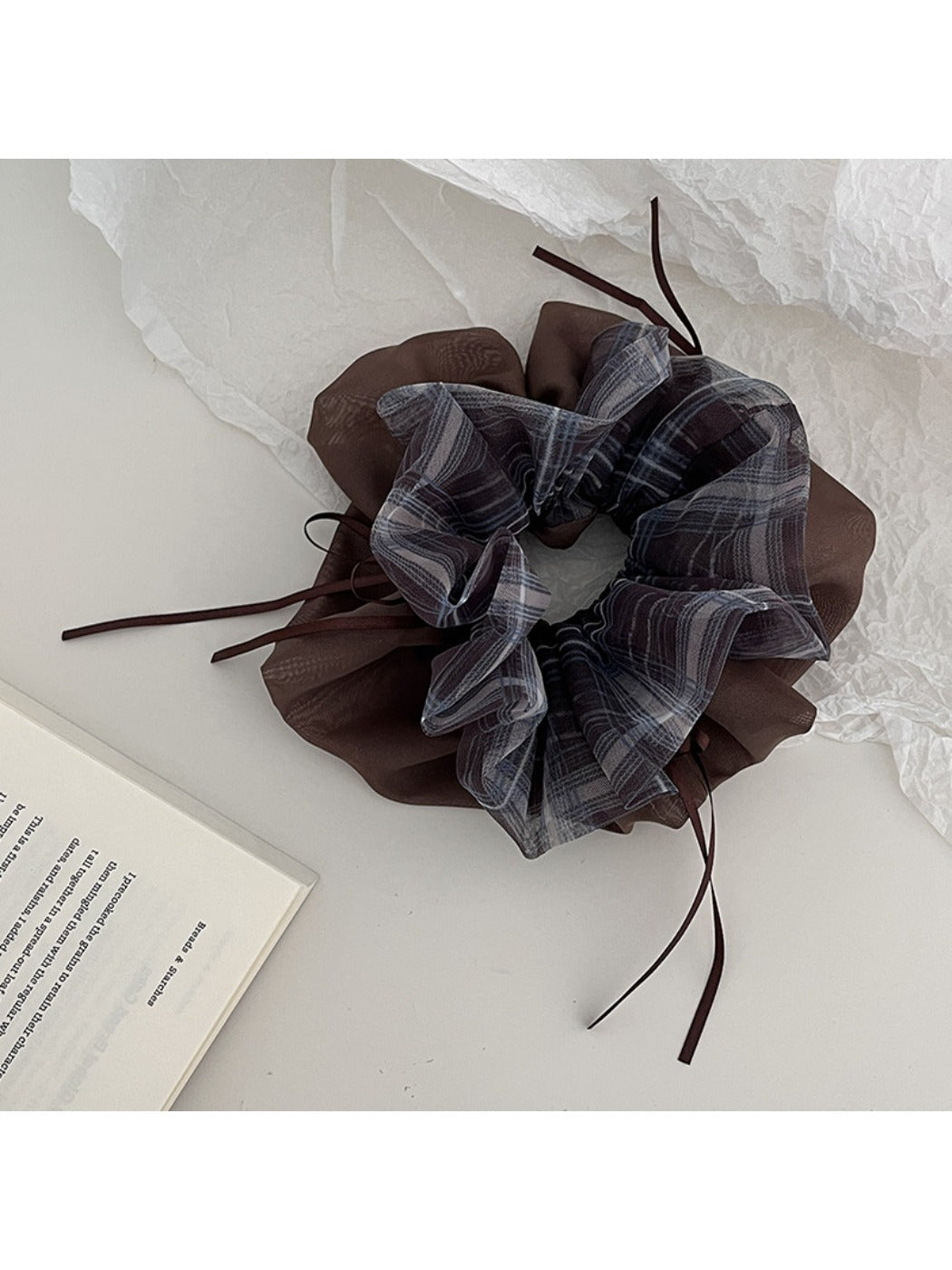 Gifty vintage plaid tulle scrunchie styled on a wrist with a neutral background