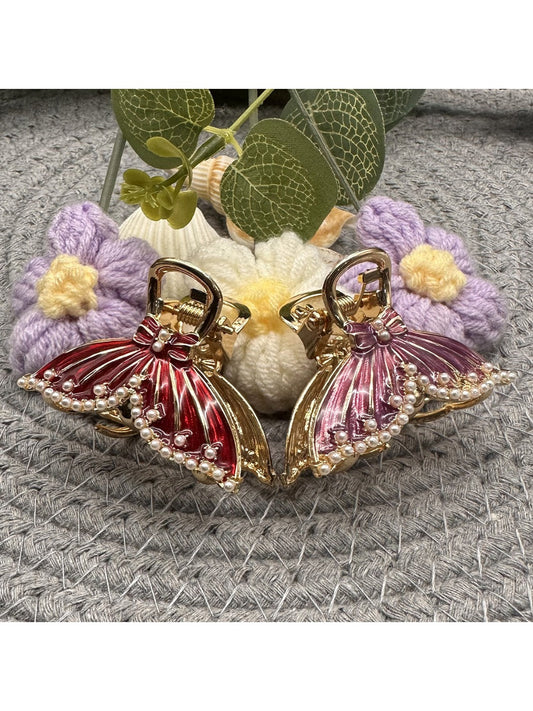 Ornate butterfly shaped hair clip with intricate filigree design in gold tone