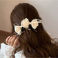 Side view of the Beau Sweet Bow Banana Clip showing the clip mechanism