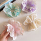 Close-up of Gifty polka dot lace double layer scrunchie showing fabric texture and lace details