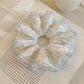 Close-up of ruffled polka dot scrunchie showing fabric texture