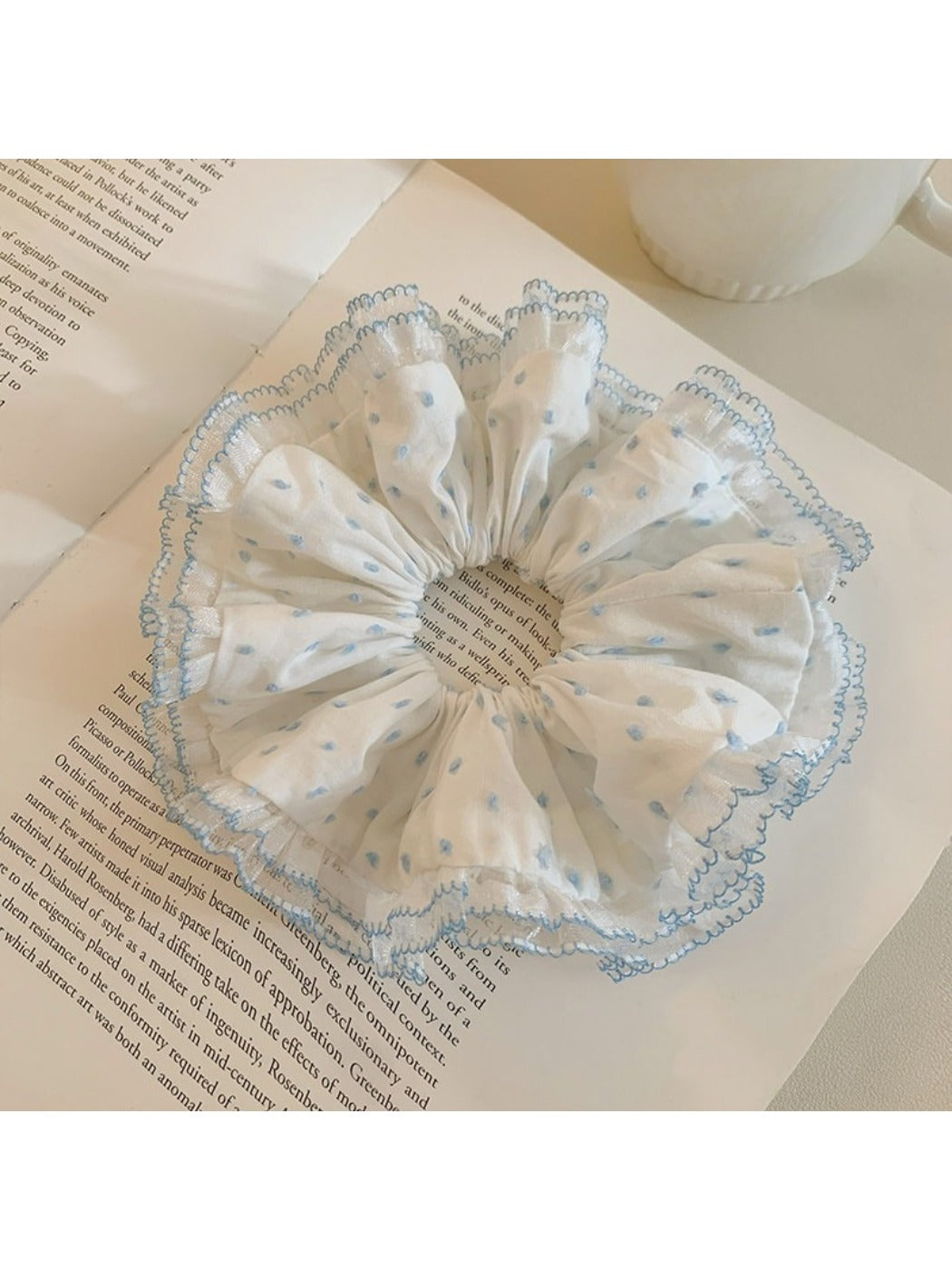 Close-up of ruffled polka dot scrunchie showing fabric texture