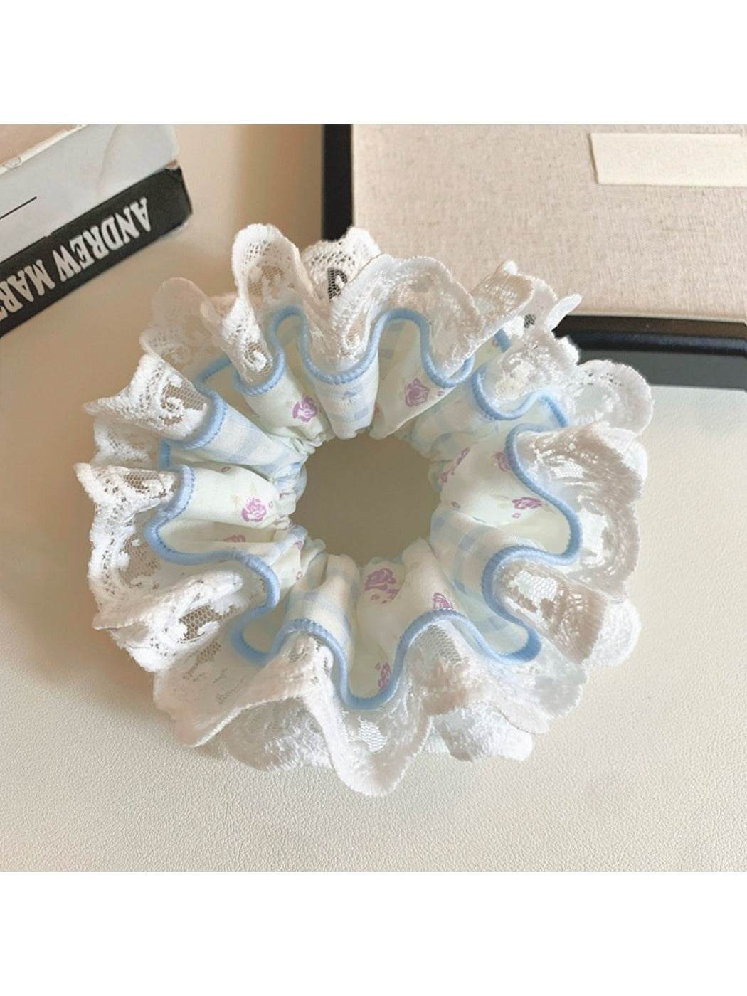 Gifty floral lace scrunchie displayed on a white background showing texture