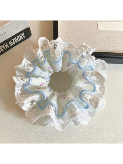 Gifty floral lace scrunchie displayed on a white background showing texture