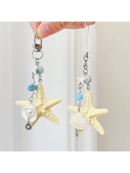 Ocean-themed keychain featuring a starfish and small fish charm on a metal ring