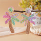 Earedge raffia palm tree earrings packaged in branded jewelry box