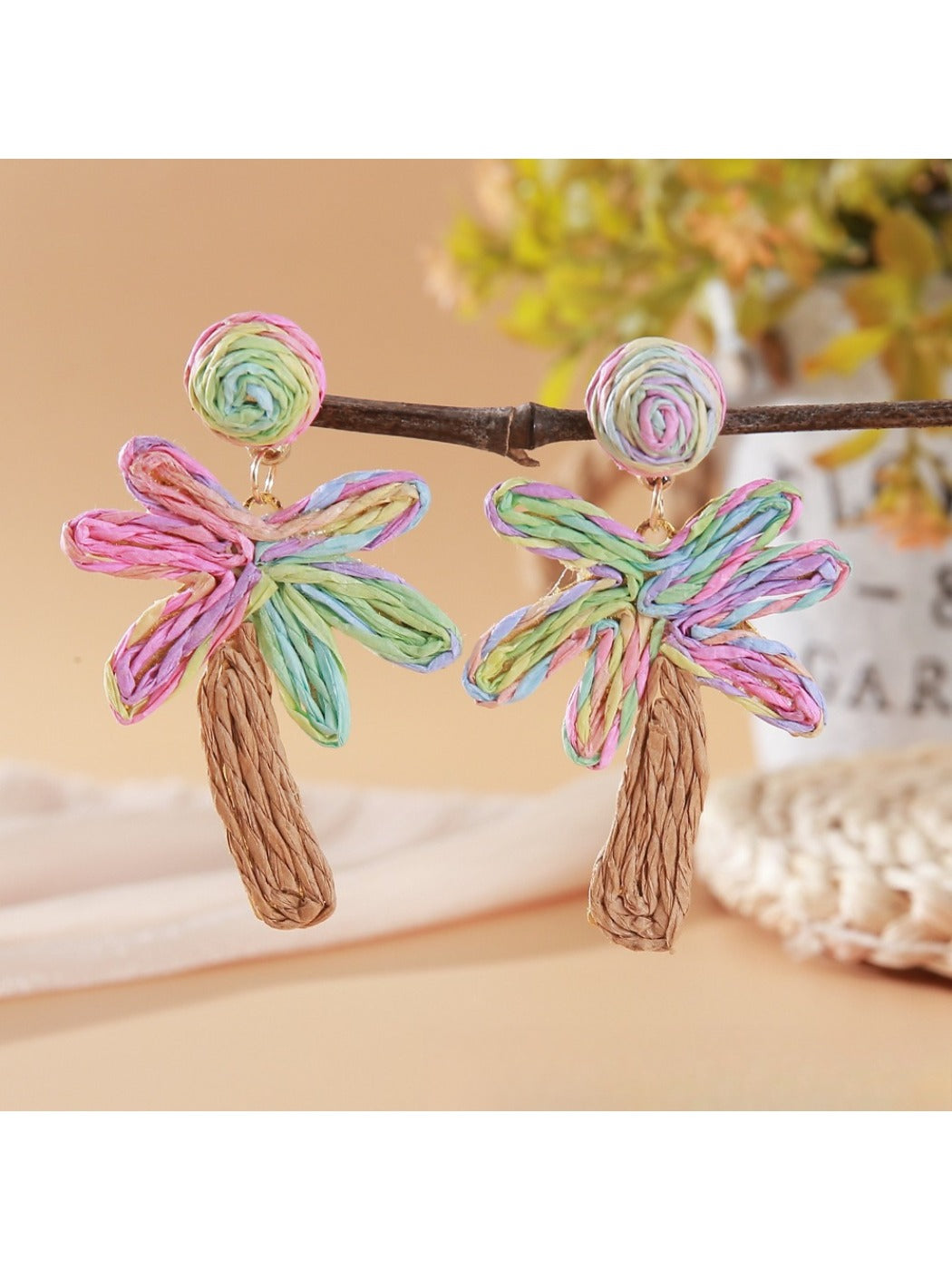 Earedge raffia palm tree earrings packaged in branded jewelry box