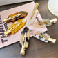 Beau acetate invisible hair clip on white background showing translucent design