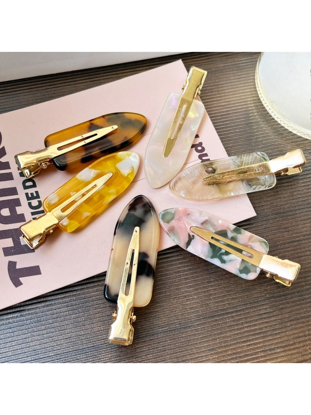 Beau acetate invisible hair clip on white background showing translucent design