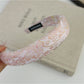 Gifty flower headband shown from the back highlighting elastic band