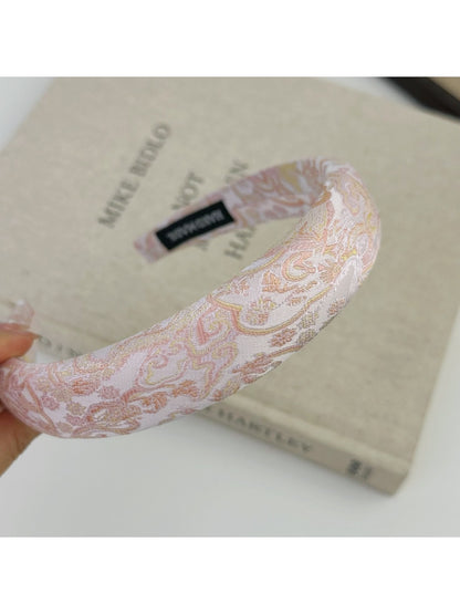 Gifty flower headband shown from the back highlighting elastic band