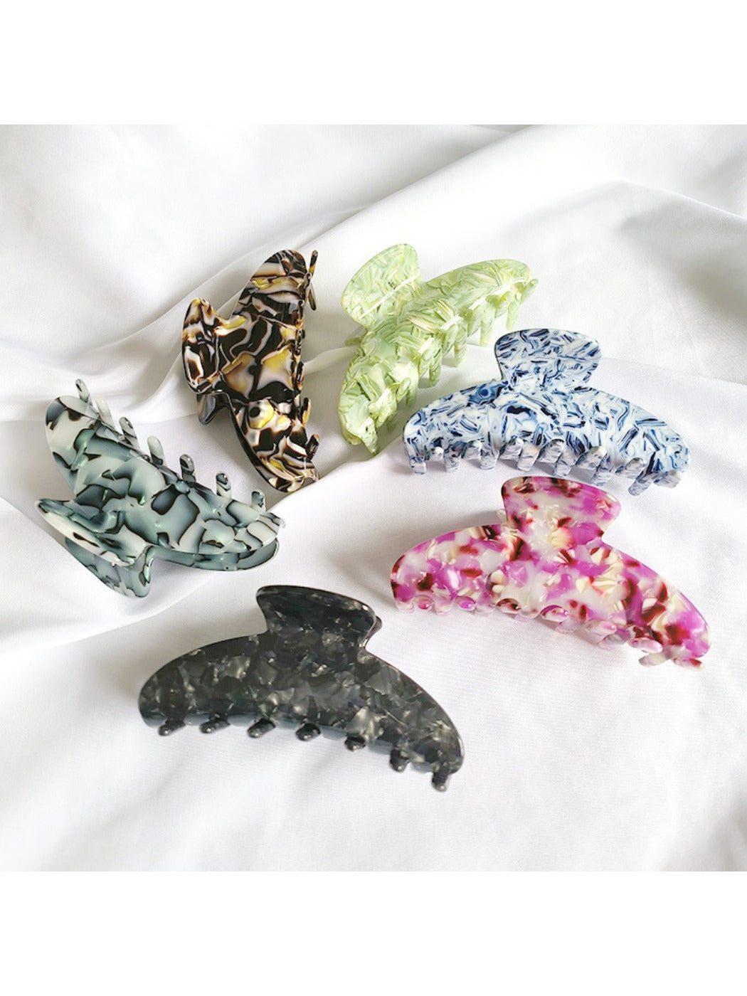 Beau vintage acetate claw clip in tortoiseshell pattern on white background