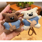 Close-up of fabric bear keychain showing texture and stitching