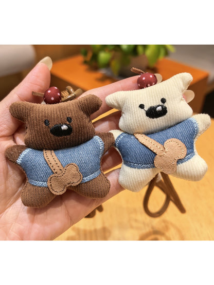Close-up of fabric bear keychain showing texture and stitching