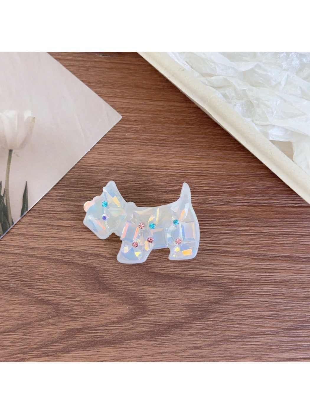 Beau puppy hair clip held in hand to show size and lightweight design