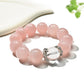 Side view of Lovra pink crystal bracelet highlighting bead texture and shine