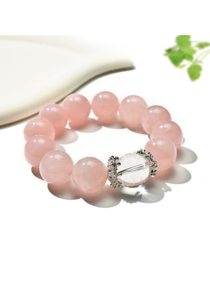 Side view of Lovra pink crystal bracelet highlighting bead texture and shine