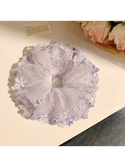 Close-up of Gifty trendy floral ruched scrunchie with pink and green flower pattern