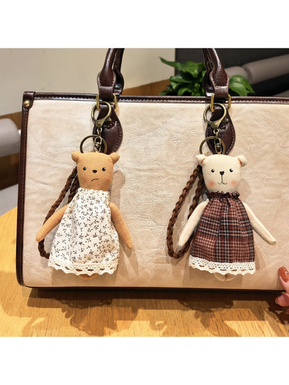 Side view of cartoon bear charm keychain highlighting its rounded ears and smooth finish