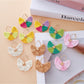 Close-up of vintage fan shaped raffia drop earrings on white background