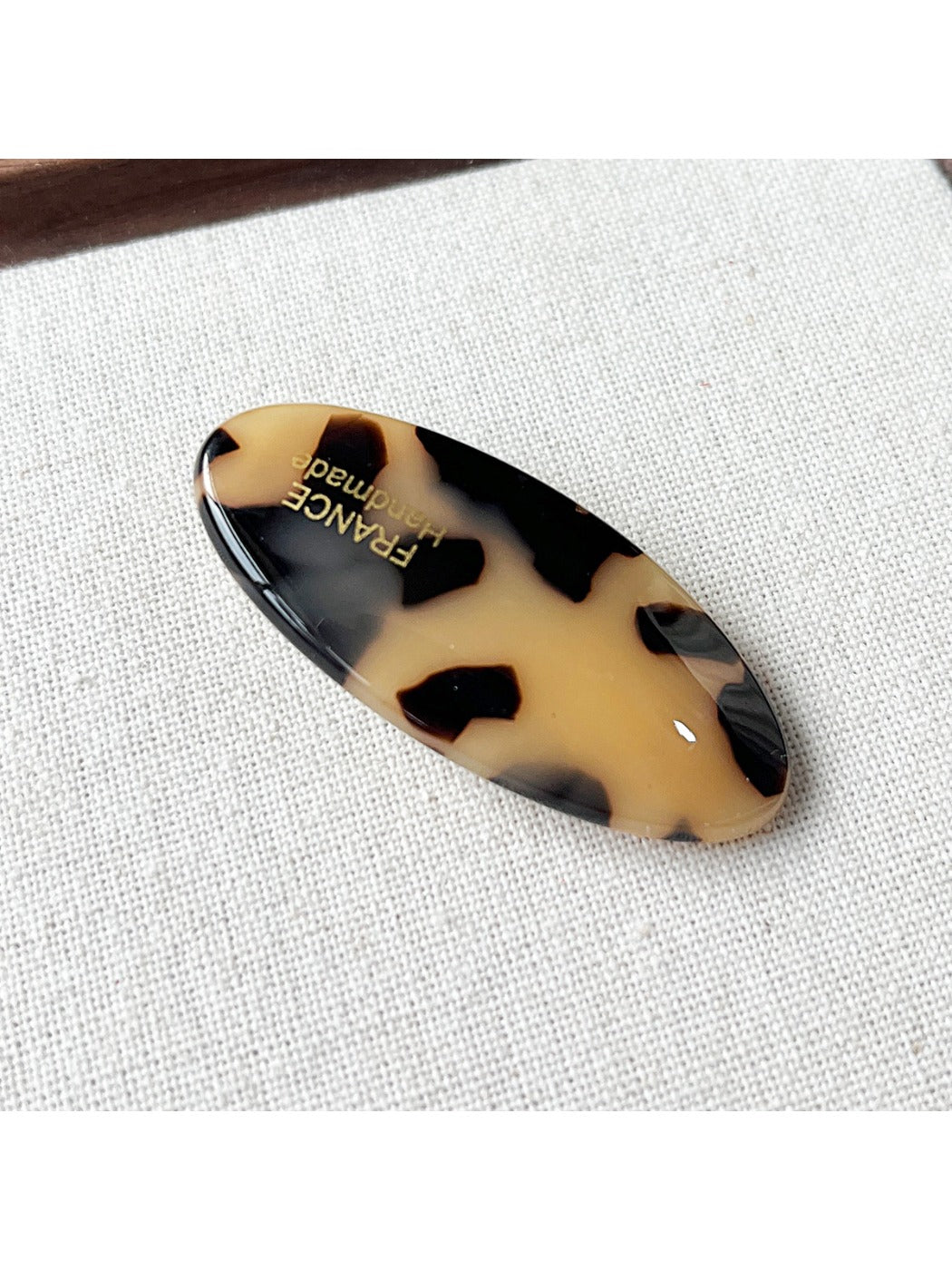 Beau Sweet Oval Acetate Hair Clip partially open showing inner clasp details