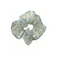 Gifty sheer tulle scrunchie styled in hair, emphasizing its delicate tiny floral pattern and sheer material