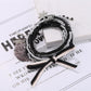 Lovra bracelet with mixed gold and black beads arranged in multiple strands