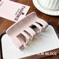 Beau plastic square claw clip positioned diagonally on white surface