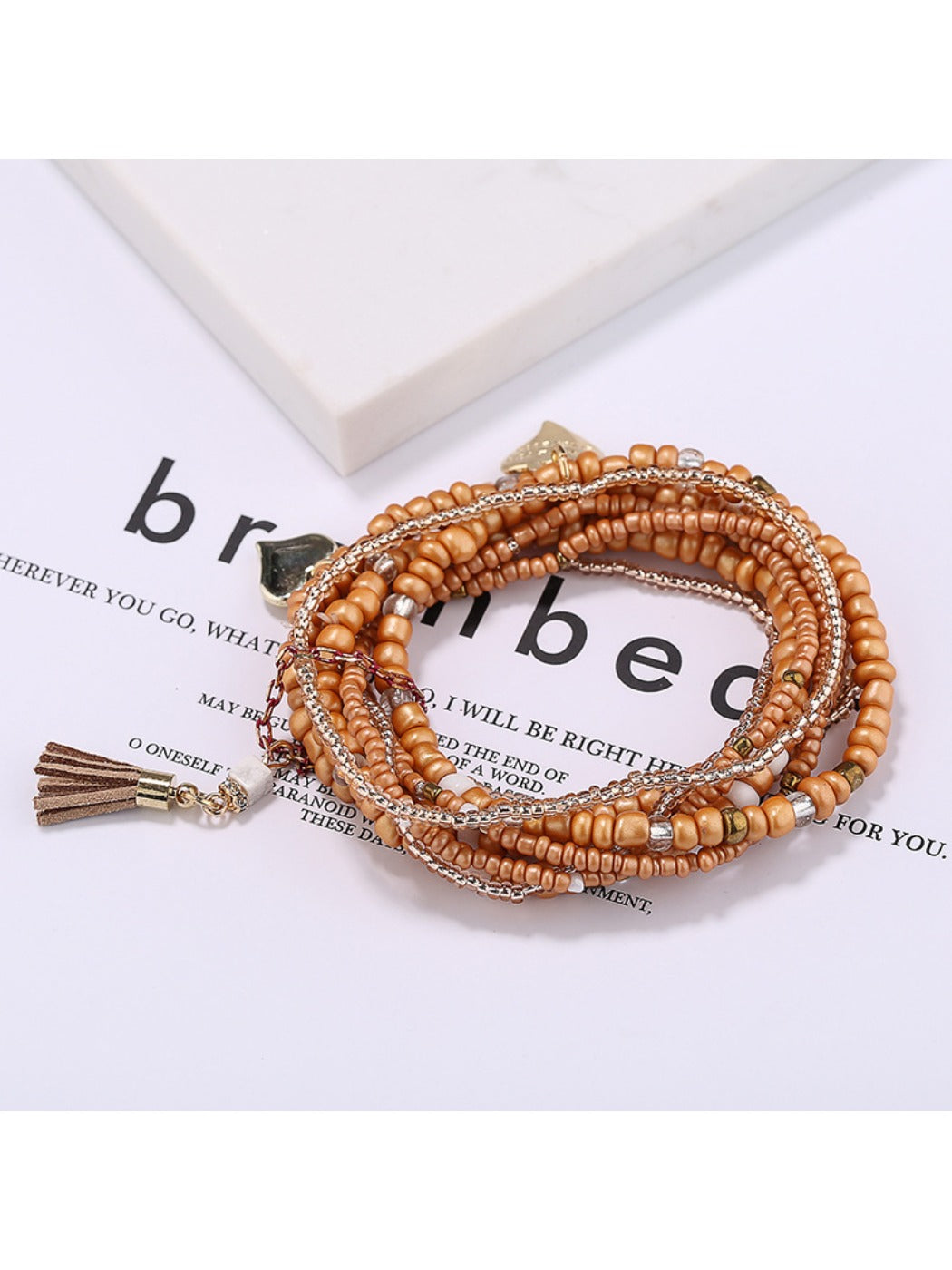 Lovra heart pendant bracelet styled with casual outfit on model's wrist