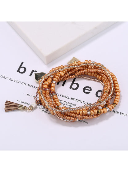 Lovra heart pendant bracelet styled with casual outfit on model's wrist