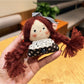 Side view of the vintage girl charm keychain highlighting the metal clasp and ring