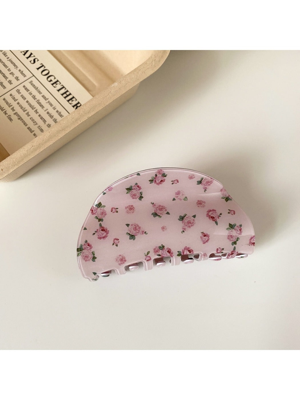 Beau pink rose print hair claw clip open to display inner teeth and spring