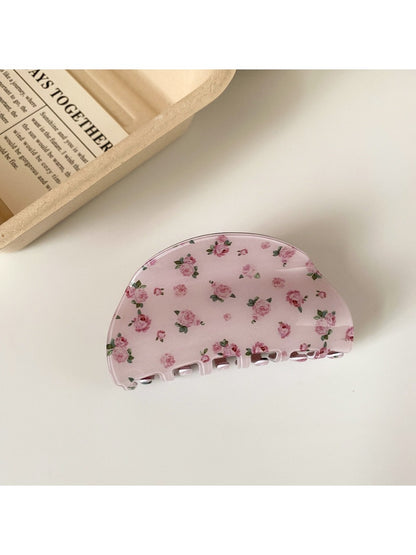 Beau pink rose print hair claw clip open to display inner teeth and spring