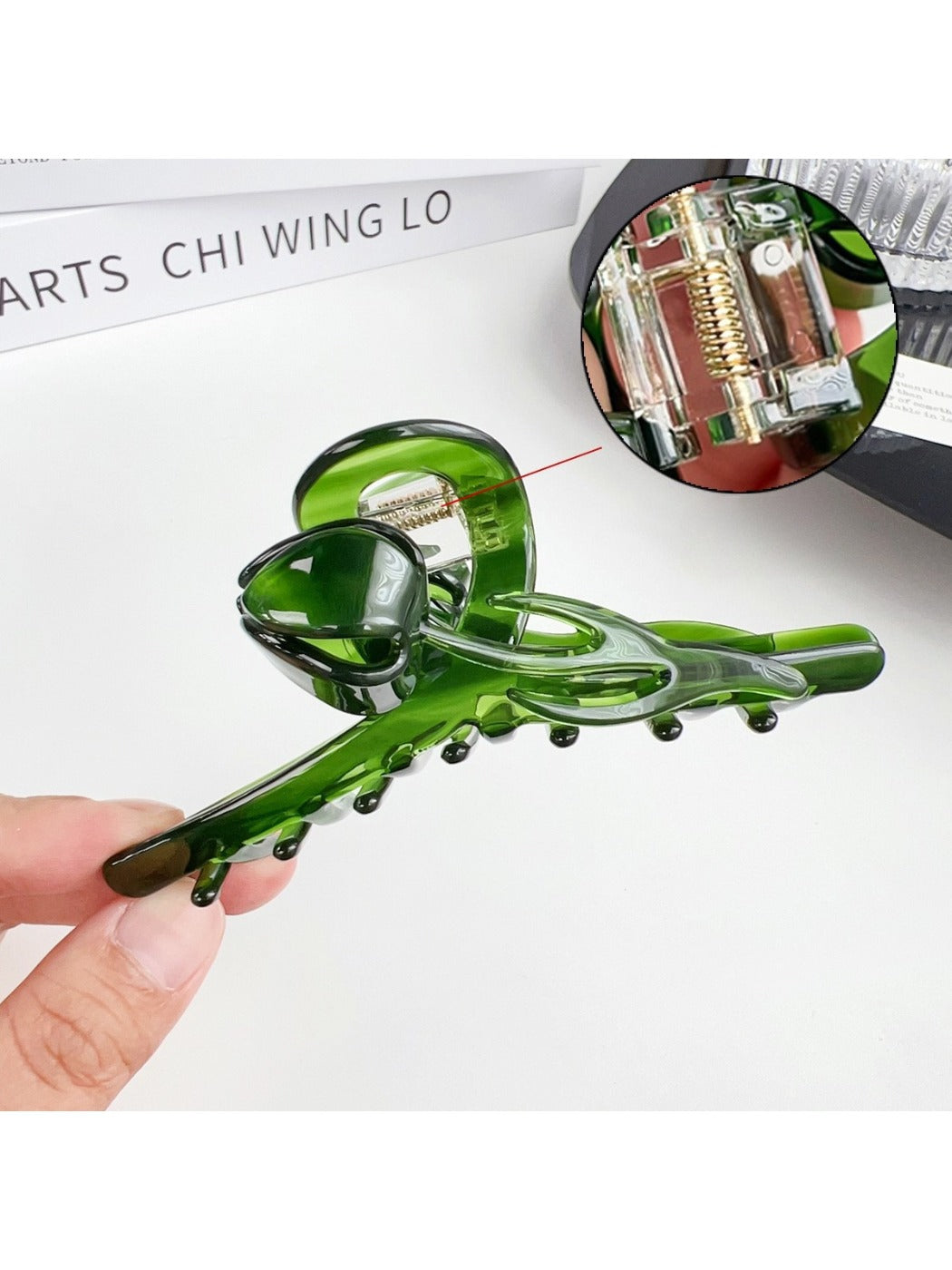 Beau hair claw clip open to display spring mechanism and teeth