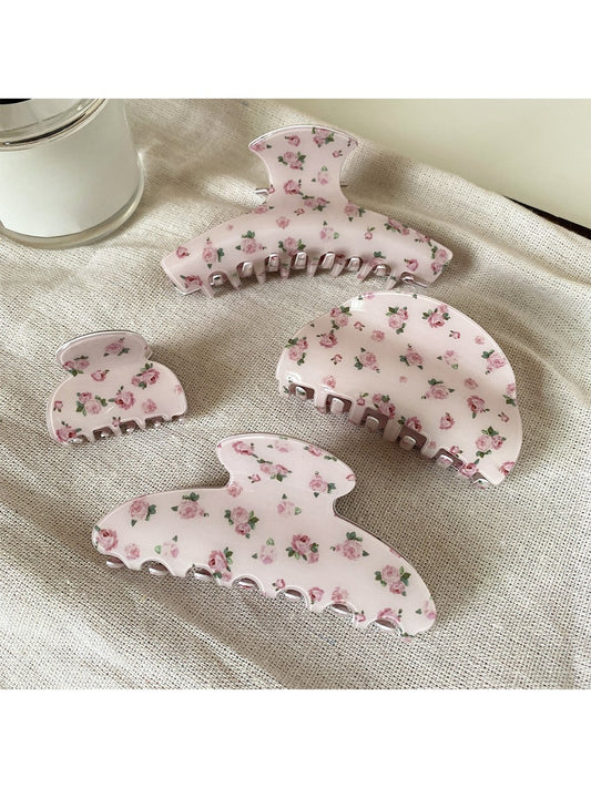 Beau pink rose print hair claw clip on white background showing floral design