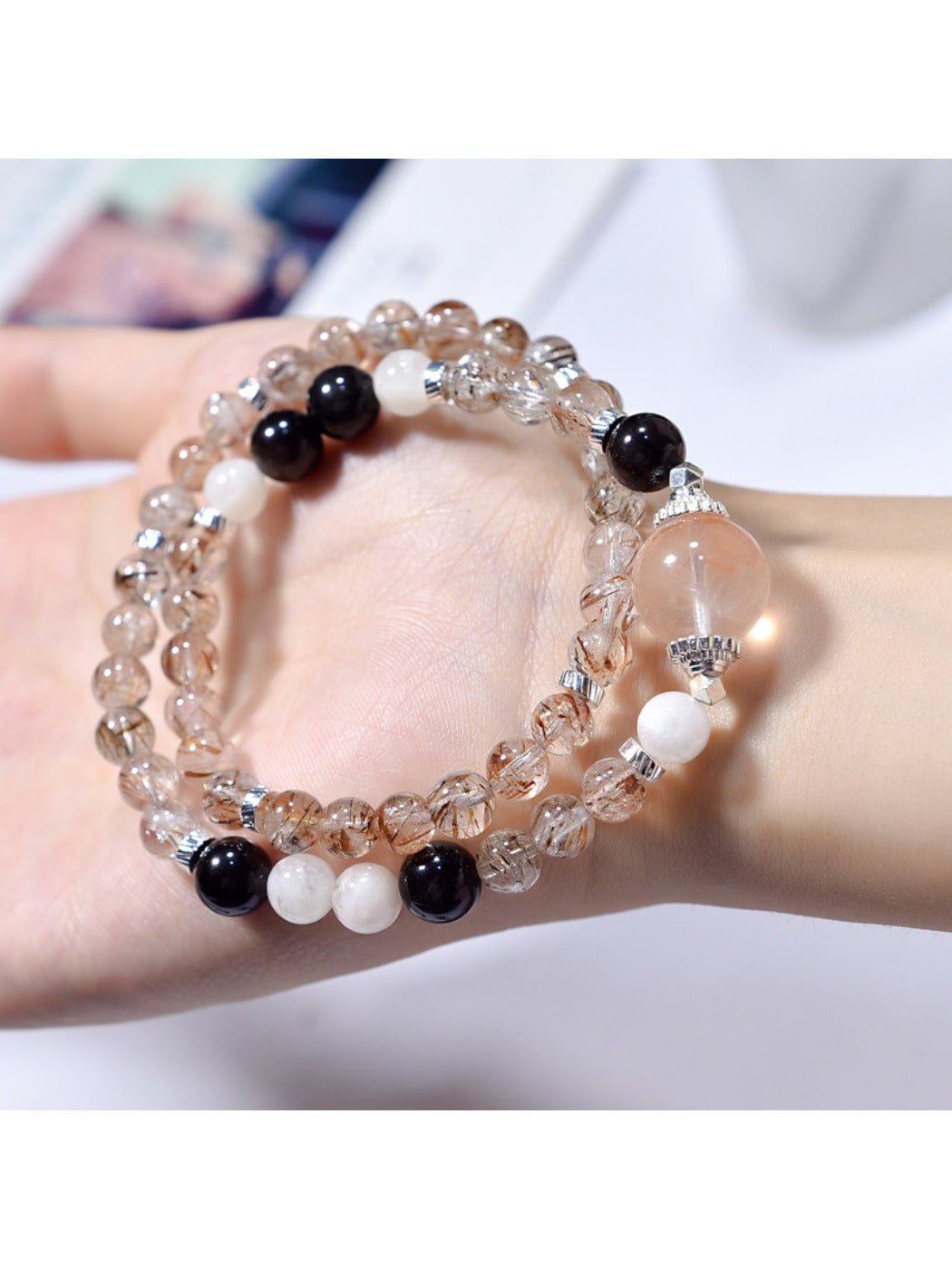 Close-up of Lovra black gold crystal bracelet showing detailed beadwork