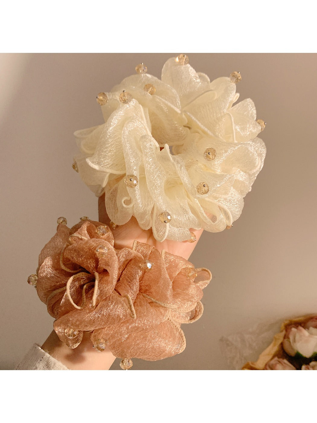 Side view of Gifty vintage scrunchie highlighting bead embellishments and elastic band