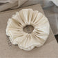 Close-up of the smooth satin material and ruched texture of the scrunchie