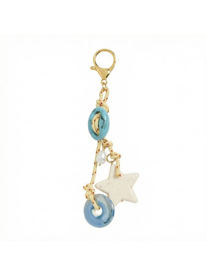 Close-up of vintage beaded keychain showing detailed beadwork and gold clasp