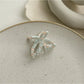 Beau butterfly claw clip in natural light emphasizing translucent acetate colors