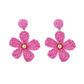 Side view of Earedge floral raffia woven vintage drop earrings showing woven texture