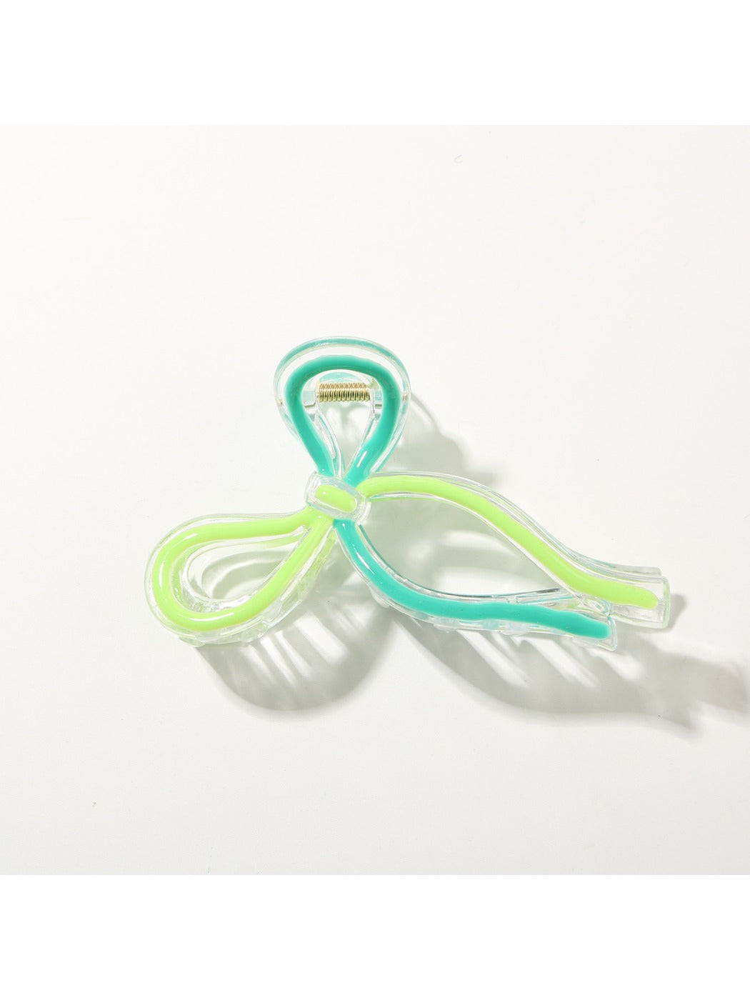 Beau Sweet Ribbon Knot Hair Clip worn in long brown hair, styled on the side