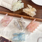 Close-up of Beau butterfly hair claw clip showing detailed wing design and clasp mechanism