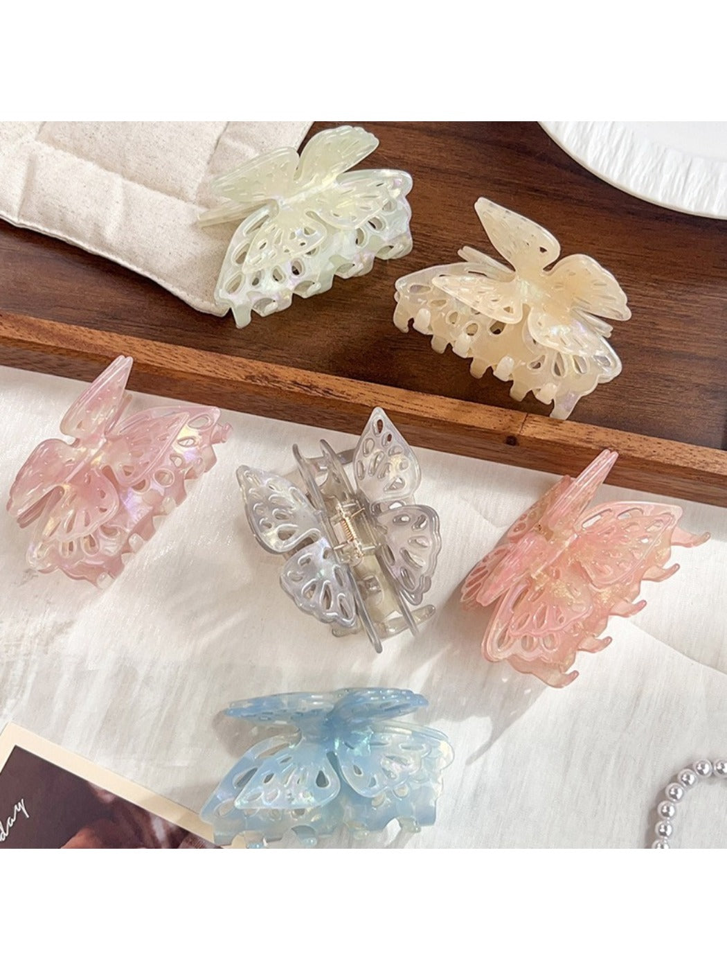 Close-up of Beau butterfly hair claw clip showing detailed wing design and clasp mechanism