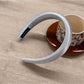 Close-up of the headband’s edge stitching and fabric quality