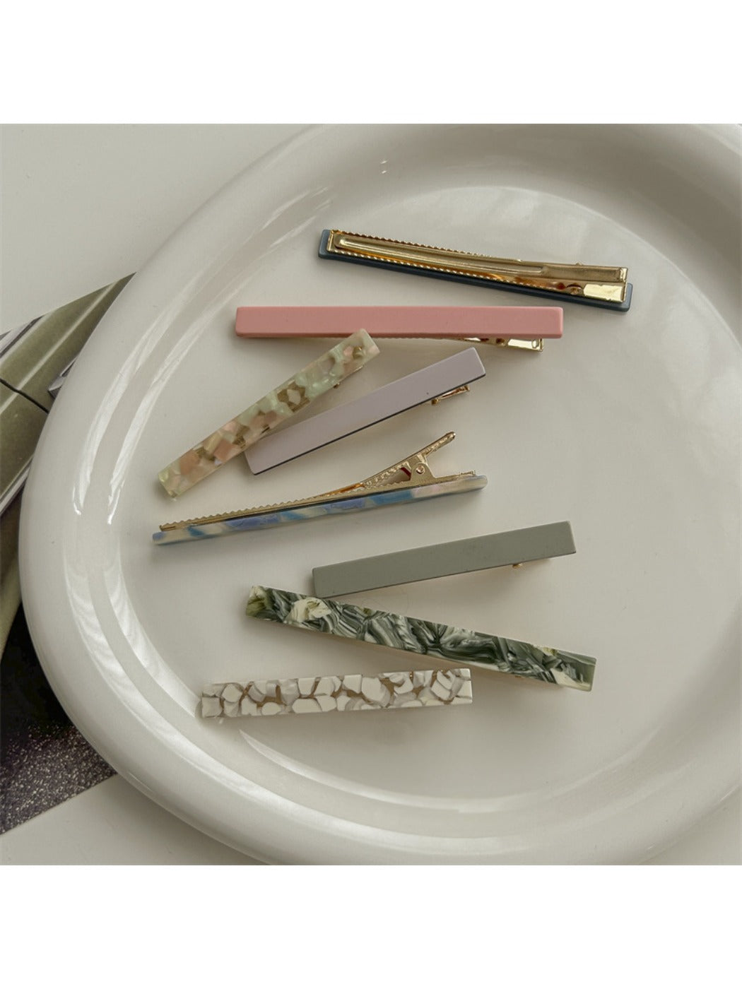 Side view of Beau acetate straight bar hair clip highlighting slim profile
