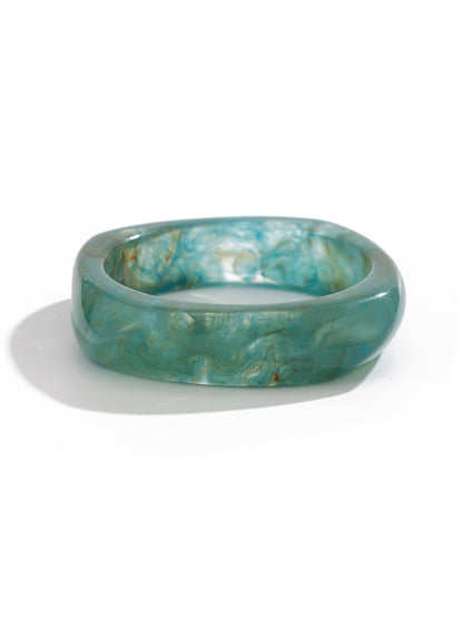 Lovra minimalist silver bracelet highlighting detailed textured irregular pattern