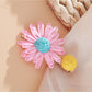 Side view of Beau raffia woven strawberry flower hair clip highlighting clip mechanism