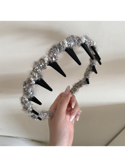 Gifty fluffy headband styled with matching accessories on wooden surface