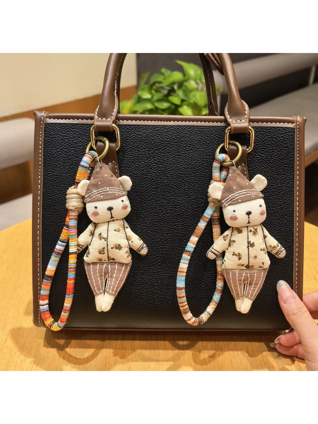 Close-up of a bear charm wearing a trendy hat on a keychain